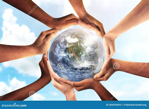 Conceptual Symbol Of Multiracial Human Hands Surrounding The Earth