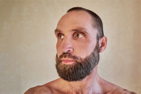 Portrait Of A Thoughtful Handsome Naked Bearded Man Looking Away Stock