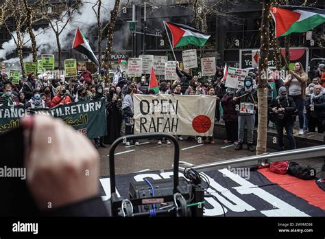 People Hold Banners And Wave Flags During The Demonstration On