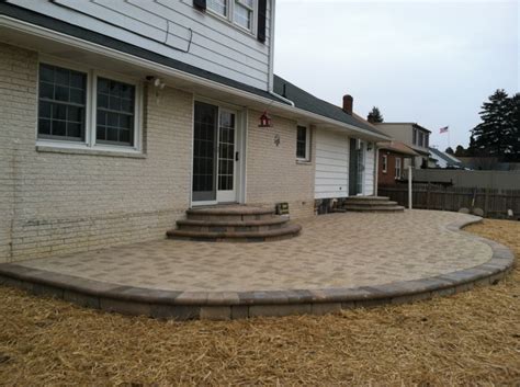 Elevated Hanover Prest Brick Patio With Rounded Steps Featuring A 90 Degree Herringbone Pattern