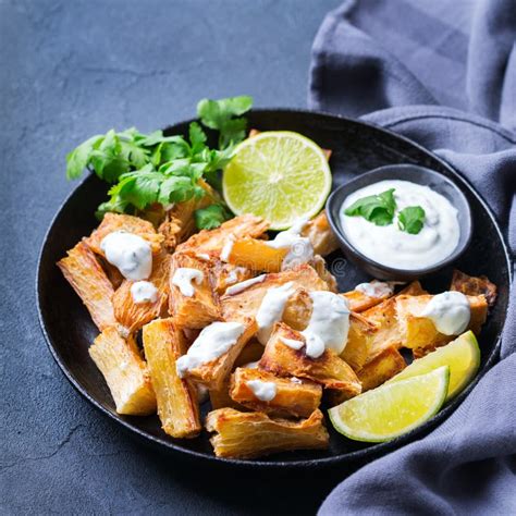 Fried Yucca Yuca Cassava Manioca Mandioca With Cilantro Sauce Stock