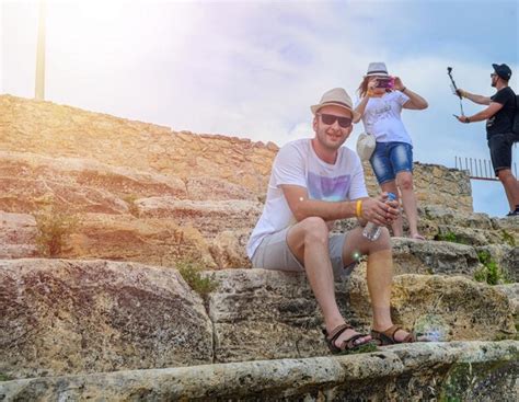 Premium Photo Cheerful Friends Travelling Taking Selfies And Smiling