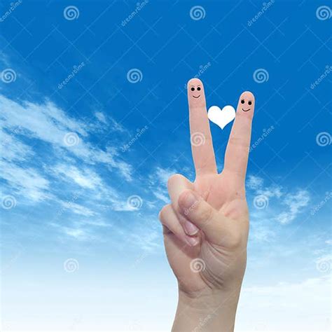 Human Or Female Hands With Two Fingers Painted With A Red Heart And