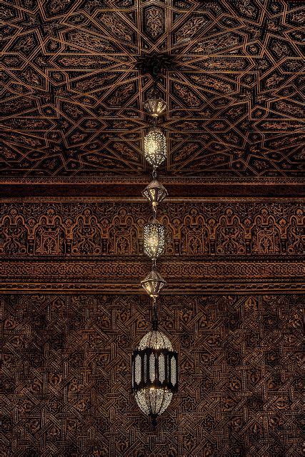 An Intricately Decorated Ceiling With Lamps And Lightshades Hanging