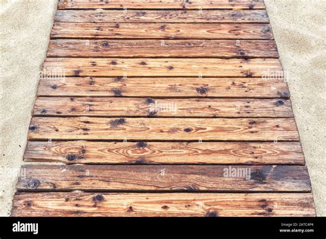 Wooden Pathway On A Sandy Beach In Summer Natural Wood Planks