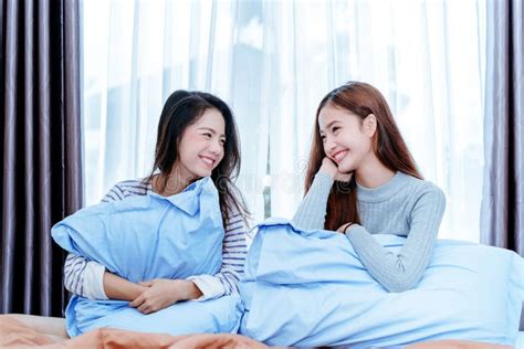 Same Sex Asian Lesbian Couple Lover Playing Cute Cat Pet Stock Image