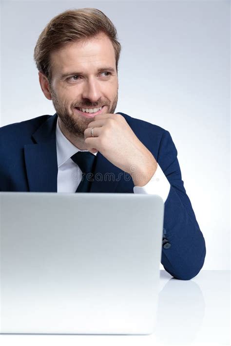 Handsome Businessman Smiling With His Hand On His Chin Stock Image