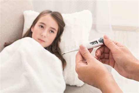 Mother Measuring Temperature of Her Ill Daughter Stock Photo - Image of ...
