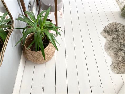 How To Paint Your Floorboards White Our Bedroom The Spirited Puddle