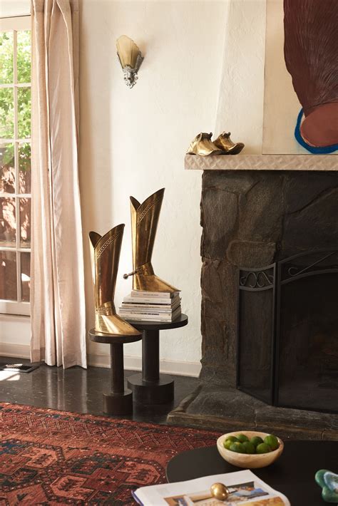 These Brass Boots Follow Madison Brill Wherever She Goes Architectural Digest