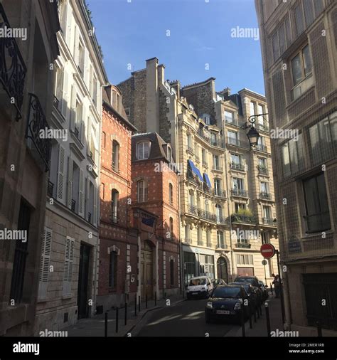 A traditional French style street in Paris with sunshine Stock Photo
