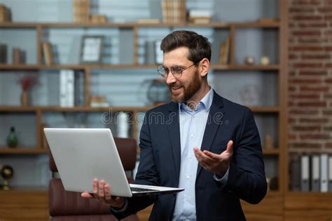 Video Call Of Businessman Mature Man Standing In Office And Holding