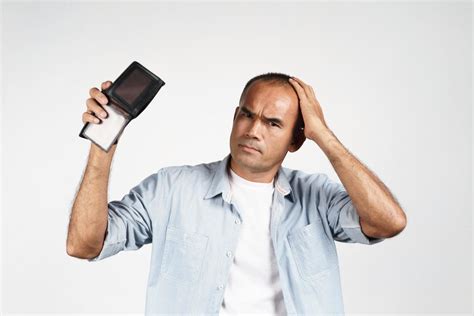 Man Holding His Empty Wallet On White Background No Money 3287974