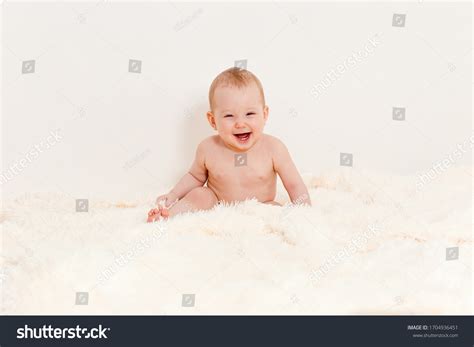 Naked Caucasian Eightmonthold Baby Sits On Stock Photo