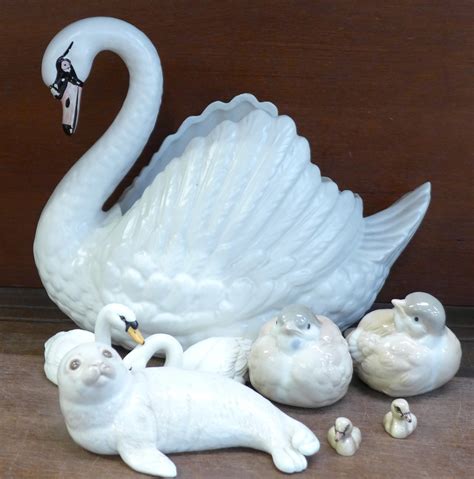 A Large Dartmouth Pottery Swan Two Beswick Swans And Two Cygnets Two