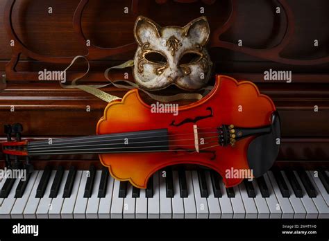 Cat Mask And Baroque Violin On Piano Keys Still Life Stock Photo Alamy