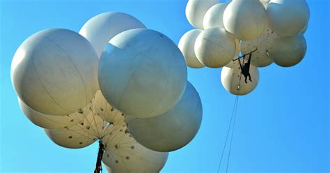 Man Flies High In Lawn Chair Attached To Balloons Time