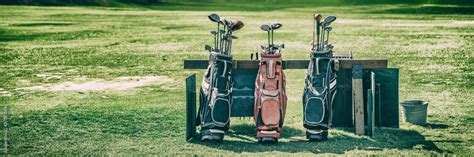 Golf bags banner with clubs on golfing course green grass background. Stock Photo | Adobe Stock