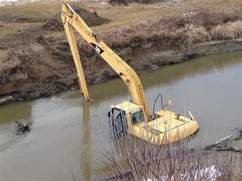 Excavator Goes For A Swim Panow