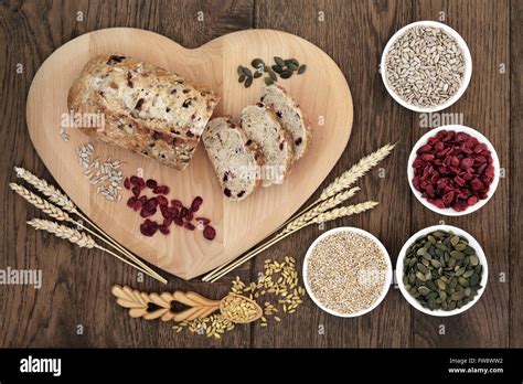 Cranberry Seed Bread On Heart Shaped Board With Wheat And Sheaths Sunflower And Pumpkin Seeds