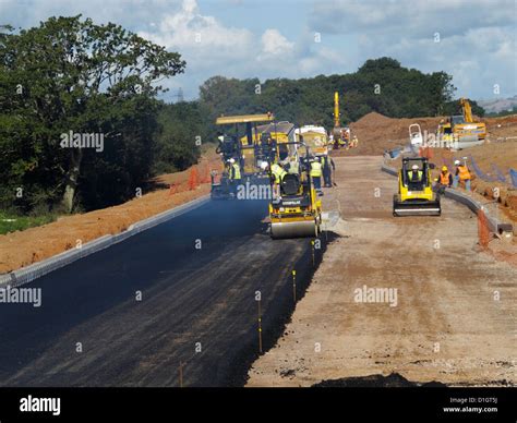 Laying asphalt tarmac blacktop surface surfacing new road roads ...