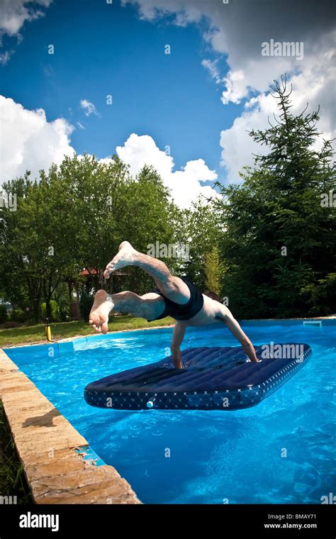 Boy Jumping In Swimming Pool Hi Res Stock Photography And Images Alamy