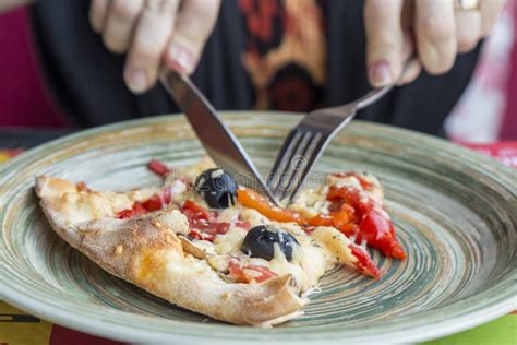 Eating A Slice Of Pizza With Fork And Knife Stock Photo Image Of