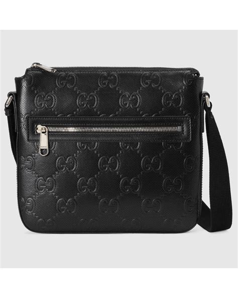 Gucci GG Embossed Small Messenger Bag in Black for Men | Lyst