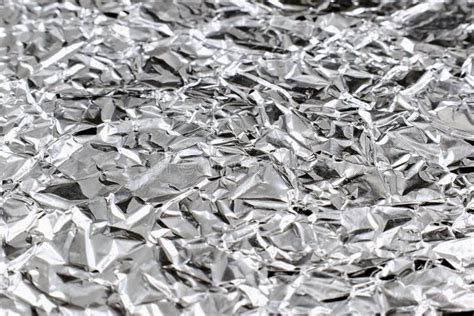 Wrinkled Silver Colored Shiny Aluminum Foil Texture Close Up Stock