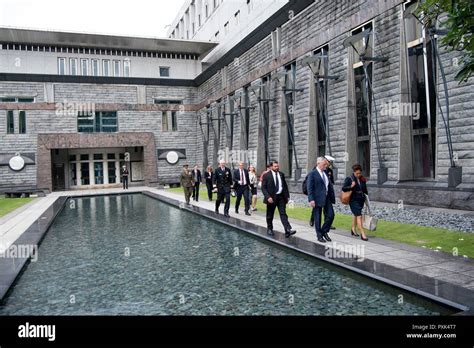 Secretary Of Defense Jim Mattis Walks With Chargé D’affaires Stephanie Syptak Ramnath During A