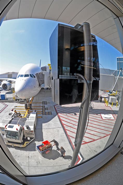 Lasers replace humans with glow sticks at LAX’s new Tom Bradley