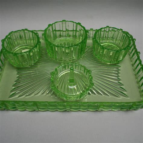 An antique green glass dressing table set- williams antiques