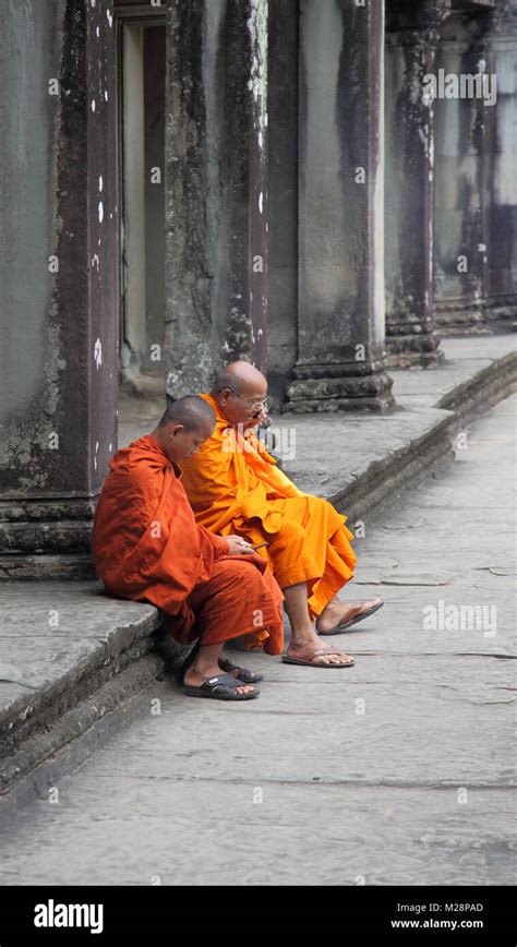 Buddhist Monks At The Ancient Temple Of Angkor Wat At Siem Reap