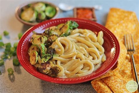 Cheesy udon noodle bowl with Brussels sprouts - Cadry's Kitchen