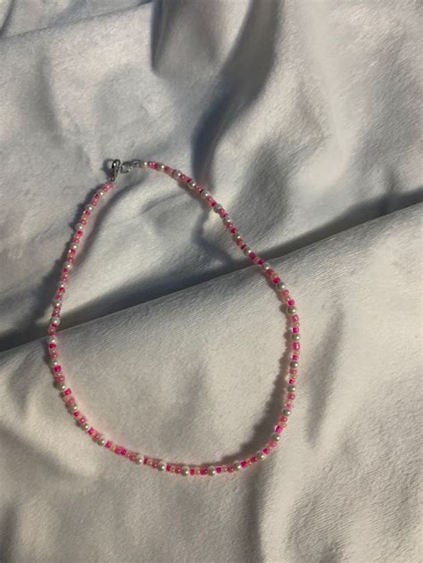 This Necklace Is Made With Pink And Peach Seed Beads And Small Pearl