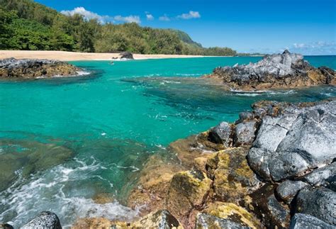 Premium Photo Lumahai Beach Kauai With Rocks And Surfer