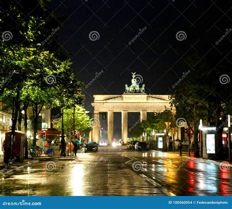 Brandenburg Gate At Night With Reflections Of Lights On Asphalt Stock