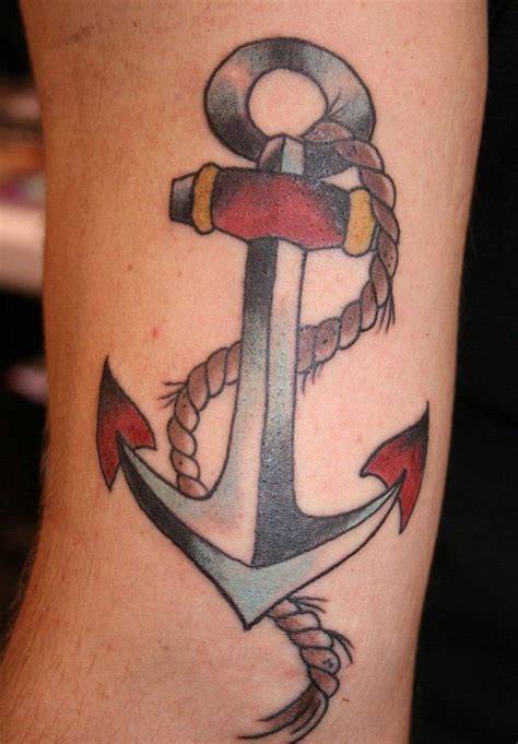 An Anchor Tattoo On The Leg Of A Person