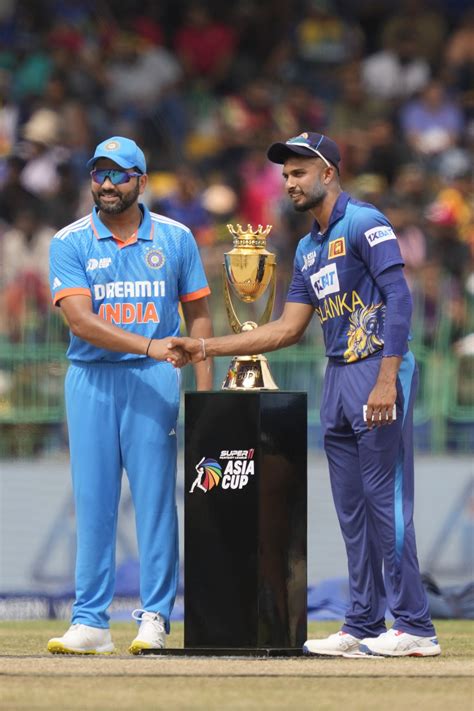 The Prize Rohit Sharma And Dasun Shanaka Pose With The Trophy