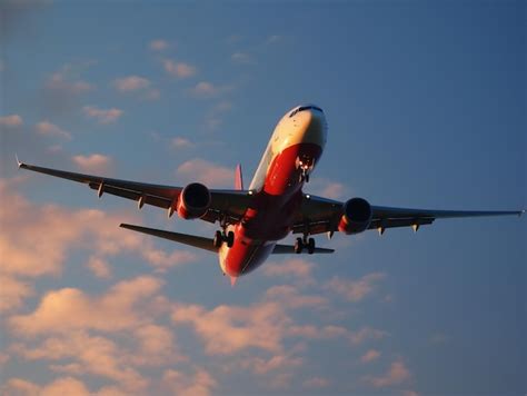 Premium Ai Image A Plane Is Flying In The Sky With The Landing Gear Down