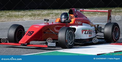 Red Formula Racing Car Close Up Action On Motor Sport Racetrack