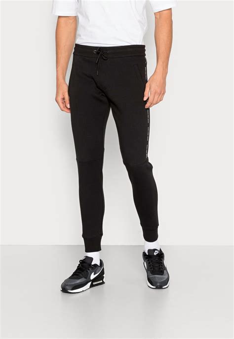 Calvin Klein Jeans Repeat Logo Pant Jogginghose Black Schwarz