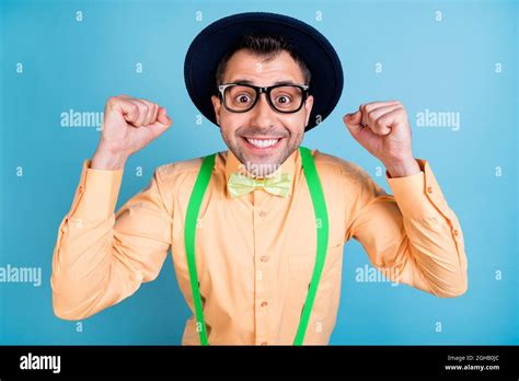 Photo Of Hooray Brunet Man Hands Fists Wear Cap Eyewear Peach Shirt