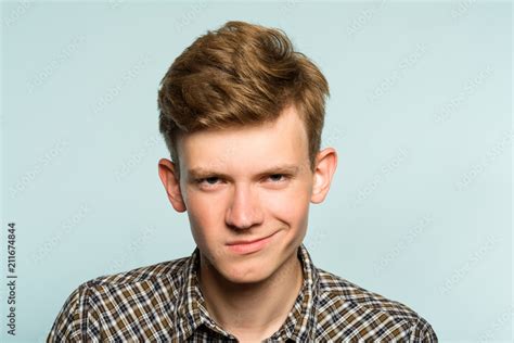 Smug Smile Man With A Self Satisfied Smirk Portrait Of A Young Guy On