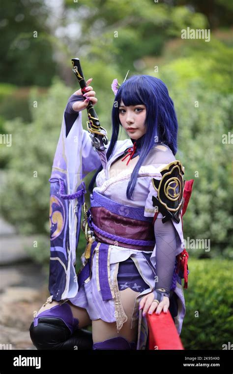 Portrait of a beautiful young woman game cosplay with samurai dress ...