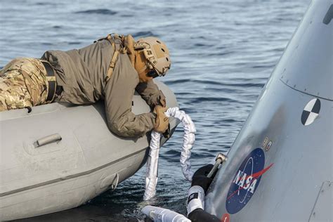 Lunar Flyby Nasas Orion Capsule Parachutes Home Safely After