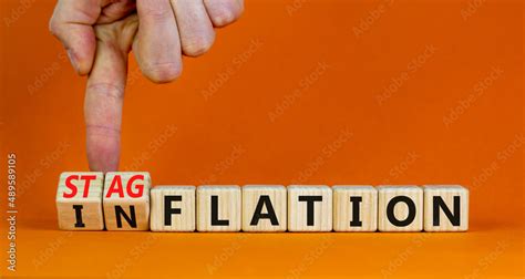 Stagflation Or Inflation Symbol Businessman Turns Cubes And Changes