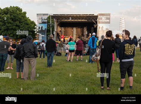 A small crowd watching a band performing at the 'Sound of Music ...