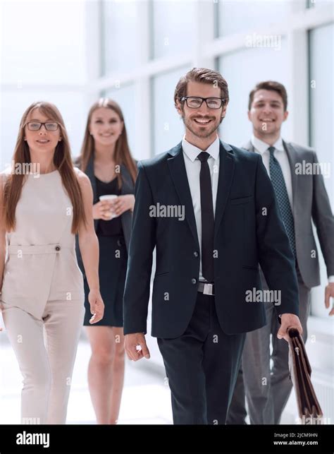 Confident Businessman And His Business Team Passing Through The Office