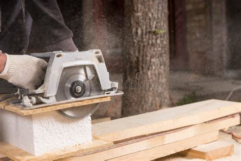 Man Using Power Saw To Cut Planks Of Wood Stock Photo Image Of Feet